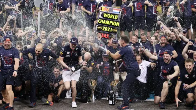 Max Verstappen celebrates becoming Formula 1 world champion with his Red Bull team in Abu Dhabi in 2021