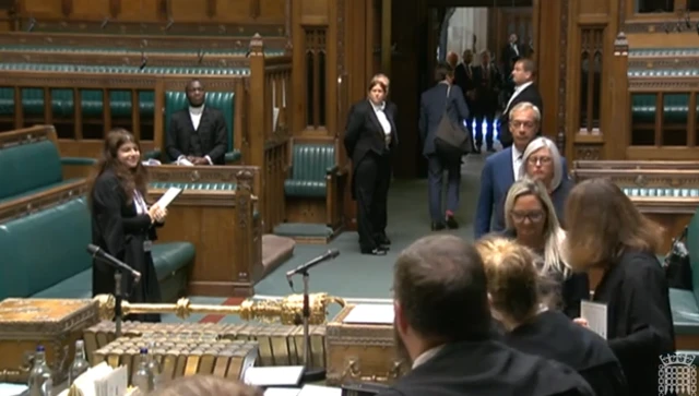 Nigel Farage waits in the queue of MPs lining up in the Commons chamber