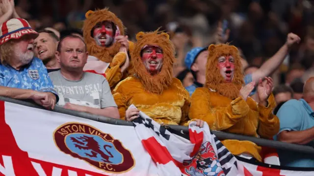 fans dressed as the three lions