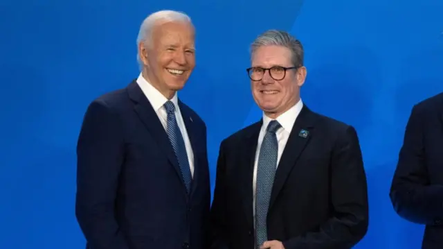 U.S. President Joe Biden, greets Keir Starmer, Prime Minister of the United Kingdom, as he arrives for a welcome ceremony at the NATO summit in Washington, Wednesday, July 10, 2024.