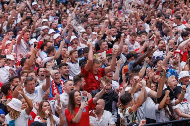 England fans celebrate at a fanzone