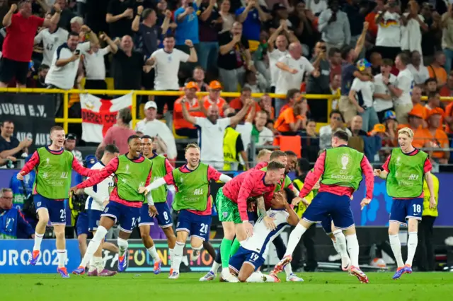 ollie watkins celebrates with his england teammates