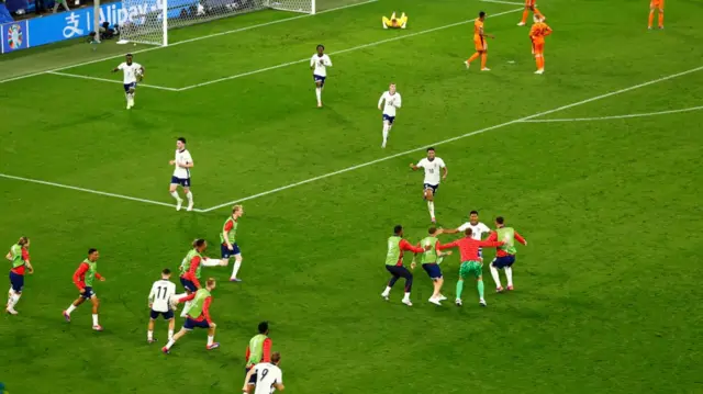 Ollie Watkins celebrates with the England substitutes after scoring against the Netherlands