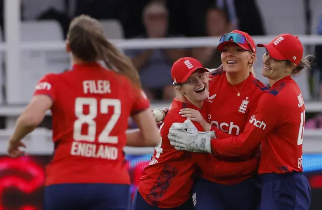 England's Sarah Glenn celebrates after taking a catch to dismiss New Zealand's Maddy Green off the bowling of Lauren Filer