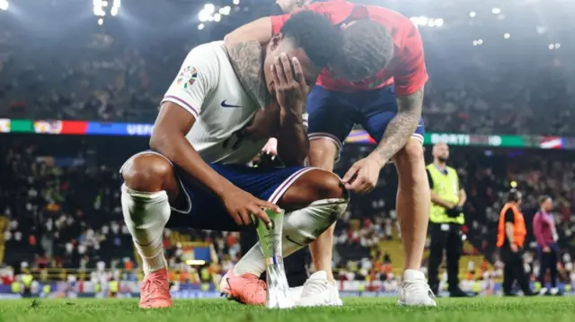 Ollie Watkins with his hand on his face after an emotional end to England's Euro 2024 game with the Netherlands