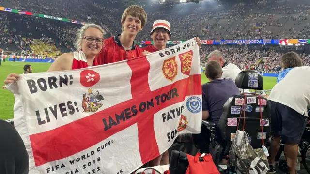 England fans holding an England flag at the game against the Netherlands in Dortmund