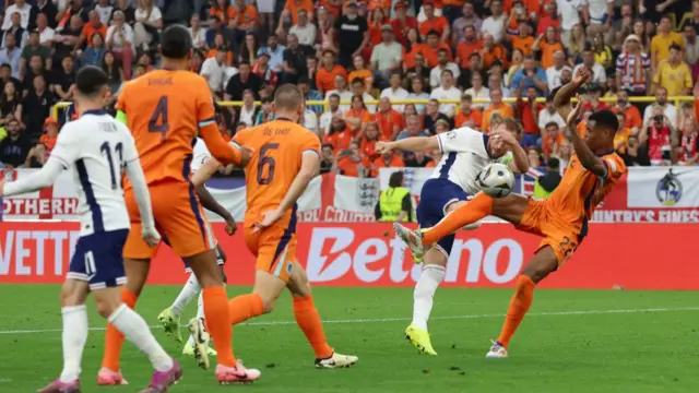 Harry Kane of England is fouled by Denzel Dumfries of the Netherlands as he takes a shot, which is later reviewed by VAR and a penalty is awarded to England