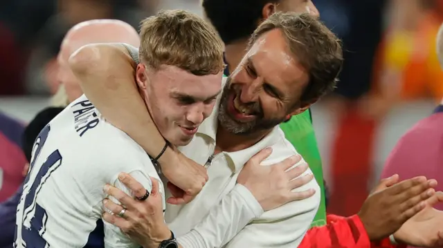 Cole Palmer and Gareth Southgate celebrate after England beat the Netherlands at Euro 2024