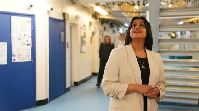 Justice Secretary Shabana Mahmood looks up as she surveys a prison in Bedford.