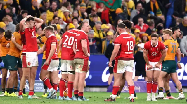 Wales players look disappointed after loss in Sydney in 2024