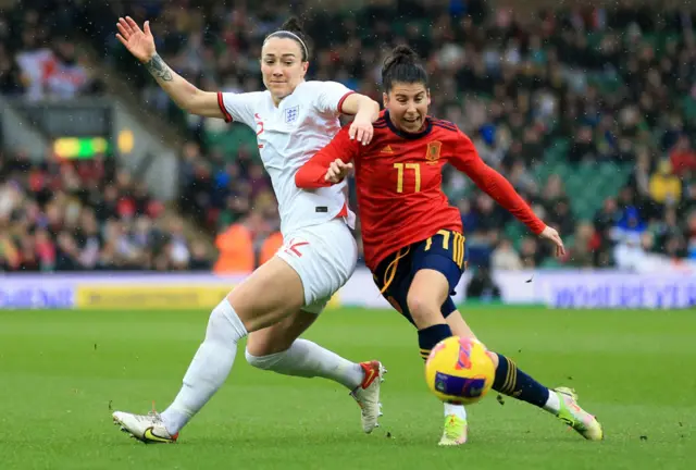 Lucy Bronze of England battles for possession with Lucia Garcia of Spain