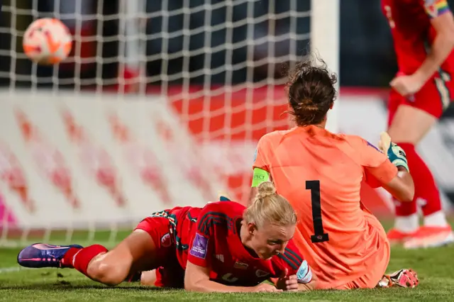 Sophie Ingle on the turf after scoring