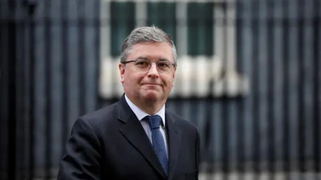 Robert Buckland walks outside Cabinet building