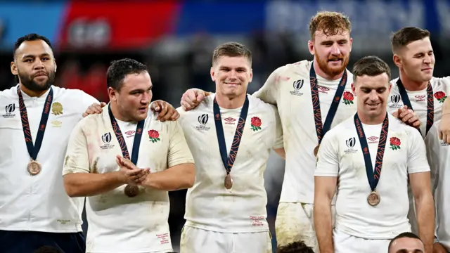 England players celebrate finishing third at the Rugby World Cup