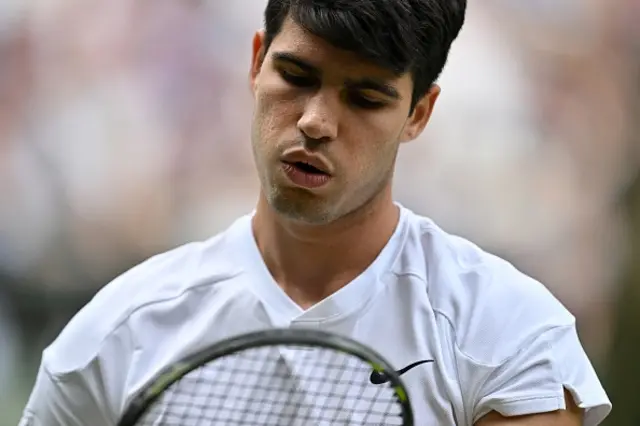 Carlos Alcaraz reacts as he plays against Russia's Daniil Medvedev