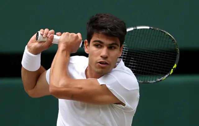 Carlos Alcaraz of Spain plays a backhand