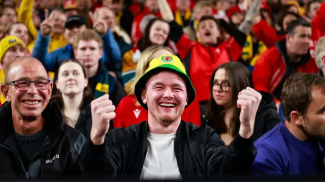 Man smiling with Wales hat on