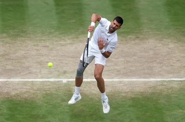 Novak Djokovic of Serbia serves to Lorenzo Musetti