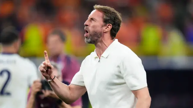 Gareth Southgate gestures 'one' to the England fans while shouting "one more"