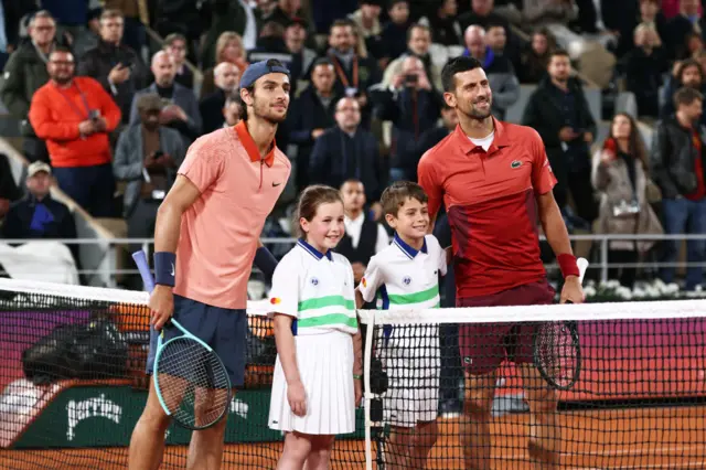 Lorenzo Musetti and Novak Djokovic at the French Open