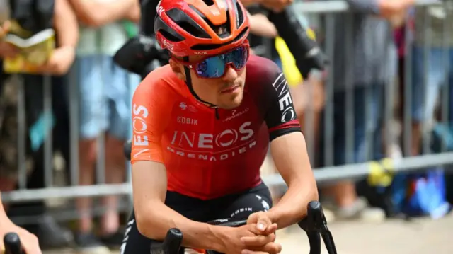 Tom Pidcock sat waiting on his bike before a stage at the 2024 Tour de France