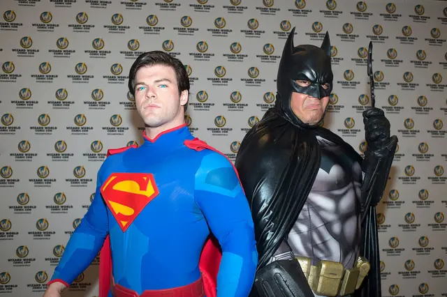 People dressed as Superman and Batman