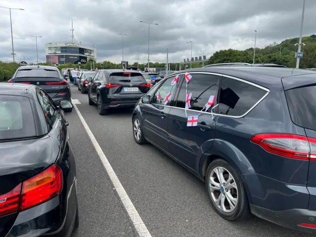 England flags draped out of cars in Folkestone