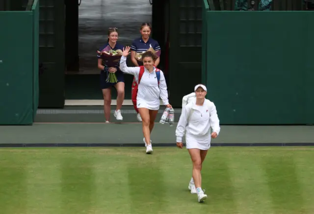 Jasmine Paolini and Barbora Krejcikova walk out