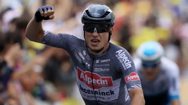 Jasper Philipsen celebrates winning stage 13 of the 2024 Tour de France