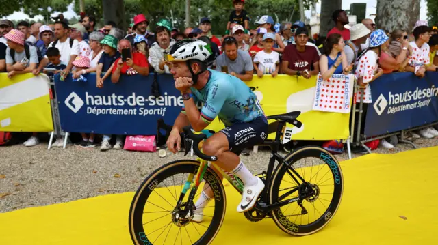 Mark Cavendish waits on his bike before stage 13 of the 2024 Tour de France