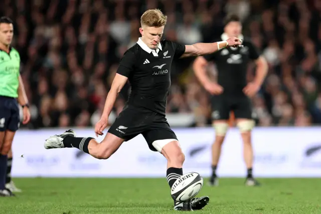 Damian McKenzie kicks a penalty