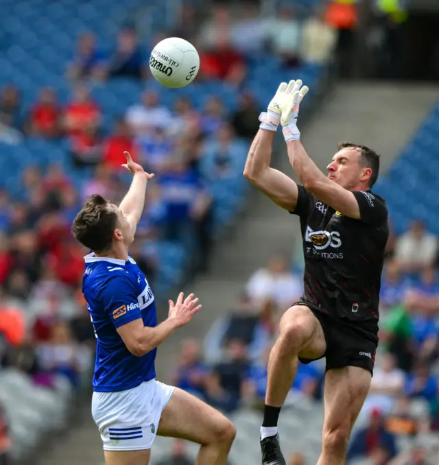 Brian Byrne is denied as Down goalkeeper John O'Hare comes out to save