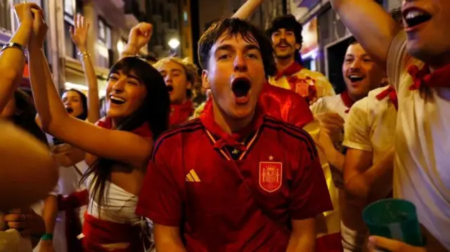 Spanish fans celebrate winning against France