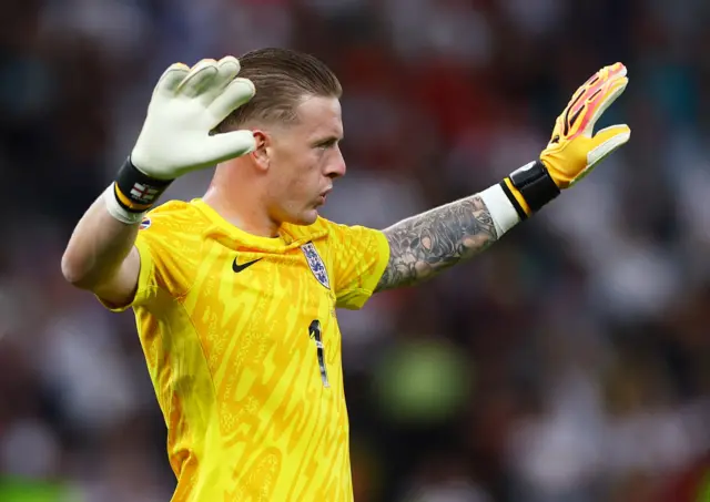 Pickford gestures for his teammates to calm down