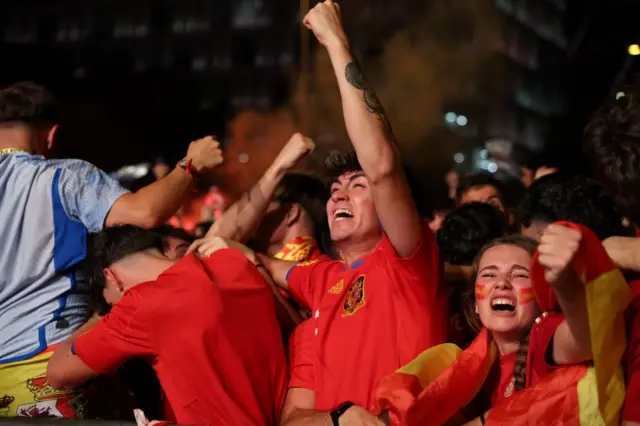 Spain fans celebrate at full time