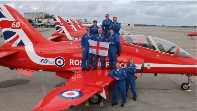 Red Arrows team with England flag