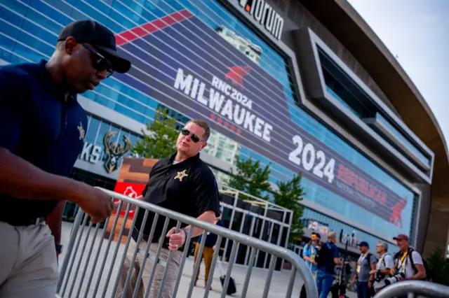 Secret Service agents set up fencing outside the Fiserv Forum, which is scheduled to host the Republican National Convention (RNC) on Monday