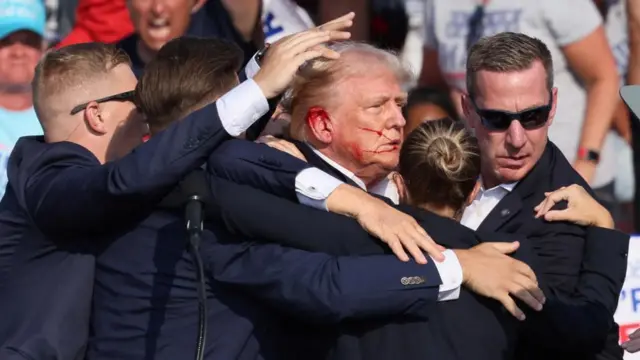 Donald Trump surrounded by Secret Service agents