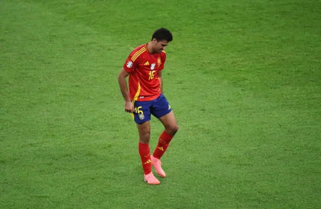 Rodri holds his hamstrong as he walks off the pitch