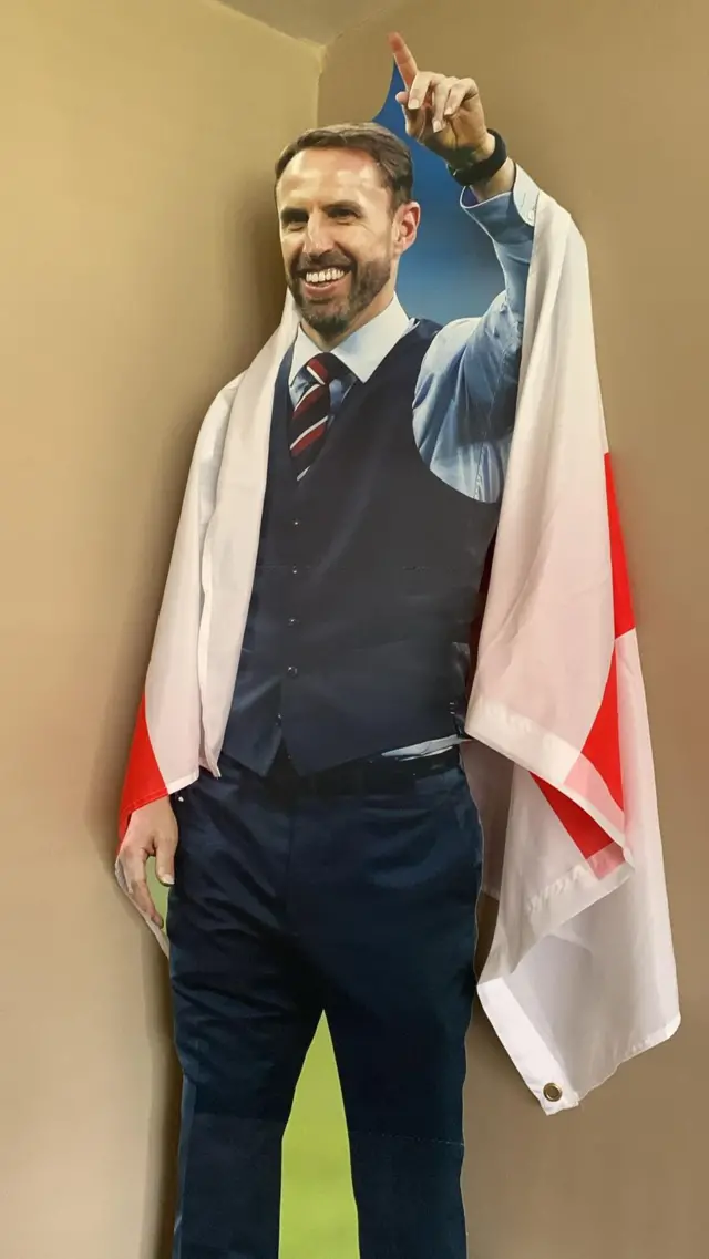 Gareth Southgate cardboard cutout with an England flag draped over it