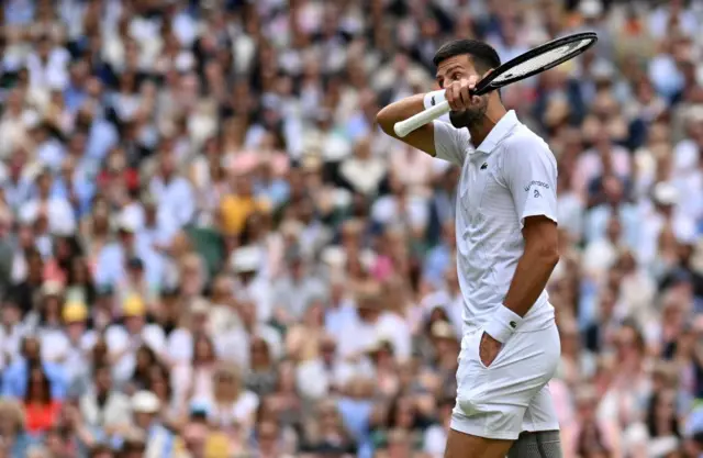 Novak Djokovic reacts