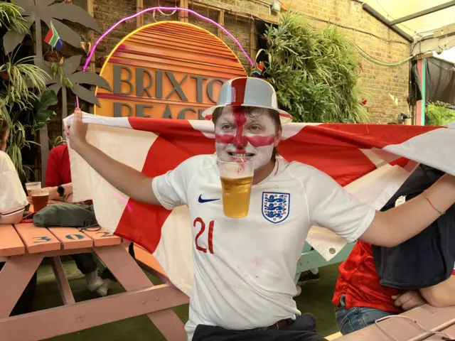 England fans with face paint drinking beer