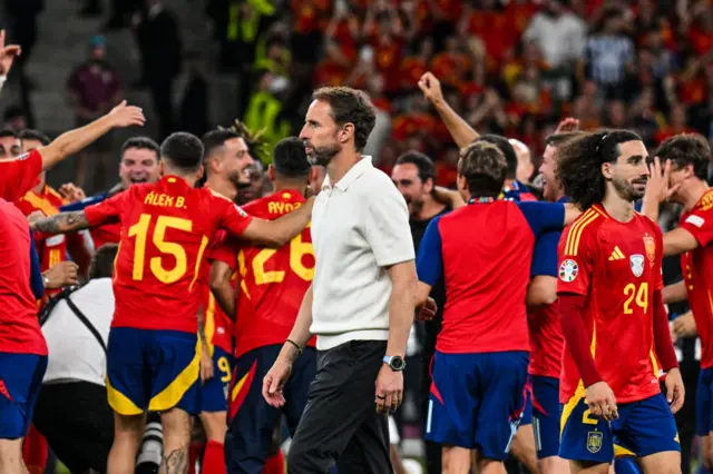 Southgate walks around the pitch