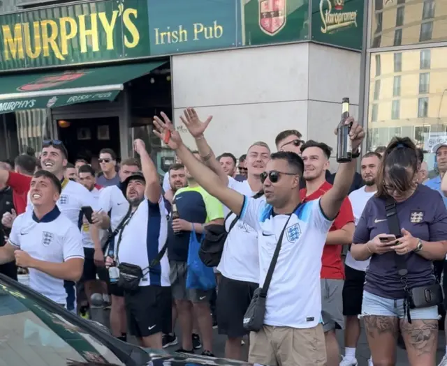 A group of England fans, chanting