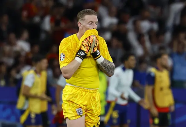 Pickford wipes his face after the equaliser