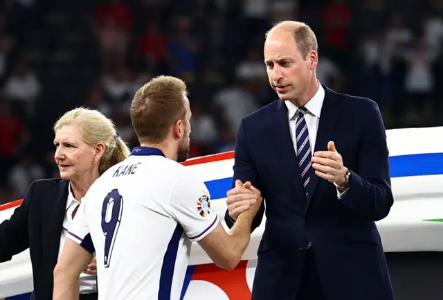 Kae is greeted by Prince William