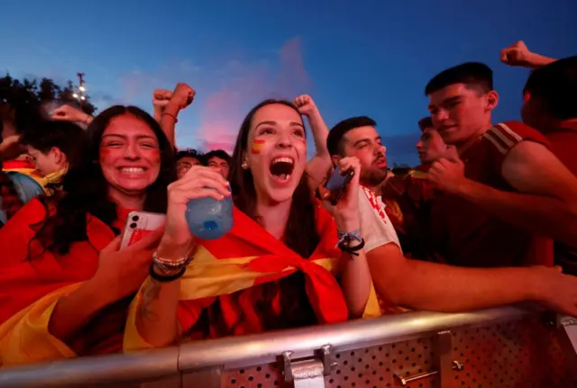 Spanish fans celebrate at full time