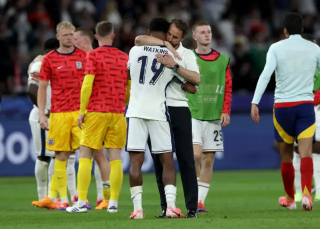 Southgate hugs Watkins on the pitch at full time