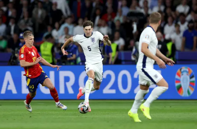 Stones runs up field with the ball