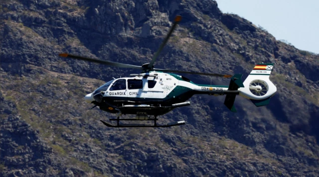 A Guardia Civil helicopter searches for the young Briton Jay Slater in the Masca